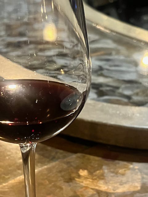 A glass of deep red wine at the Rappahannock bar